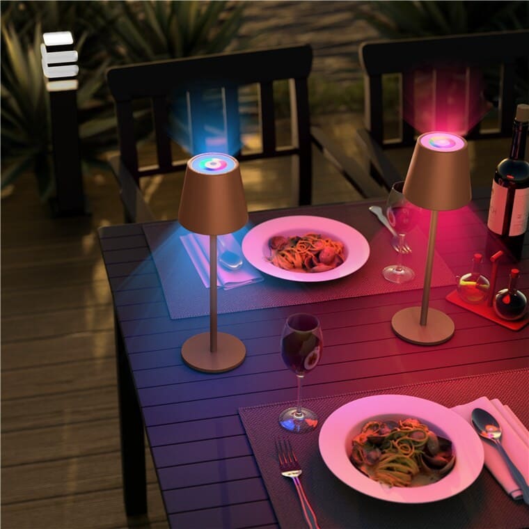 LED Table Lamp with Color Change, RGB, and Dimmable, IP44.|Bronze|The LED table lamp with color change is a stylish and functional lighting solution that combines modern technology with elegant design. This wireless rechargeable LED table lamp with color change is perfect for both indoor and outdoor use. The black lamp features a minimalist Scandinavian design that fits beautifully into any room – the living room, bedroom, or dining room – and also creates a fantastic ambiance for garden parties. Its sturdy metal construction ensures both stability and long-lasting durability.goobay